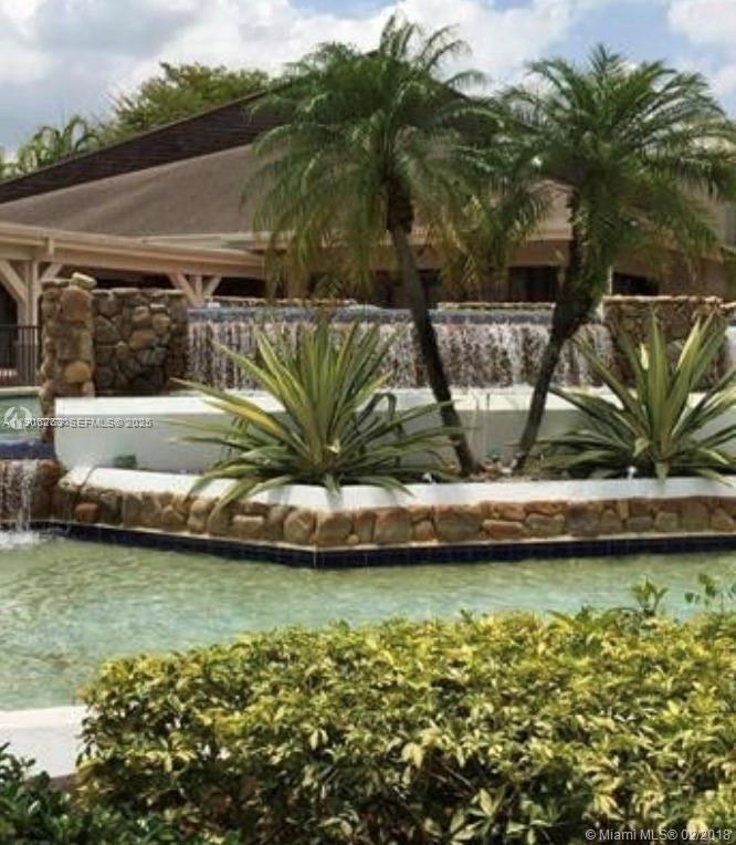 15065 Southwest 49th Lane, Unit E109 Miami, FL 33185 - Photo 21 of 21 a view of a swimming pool with a patio