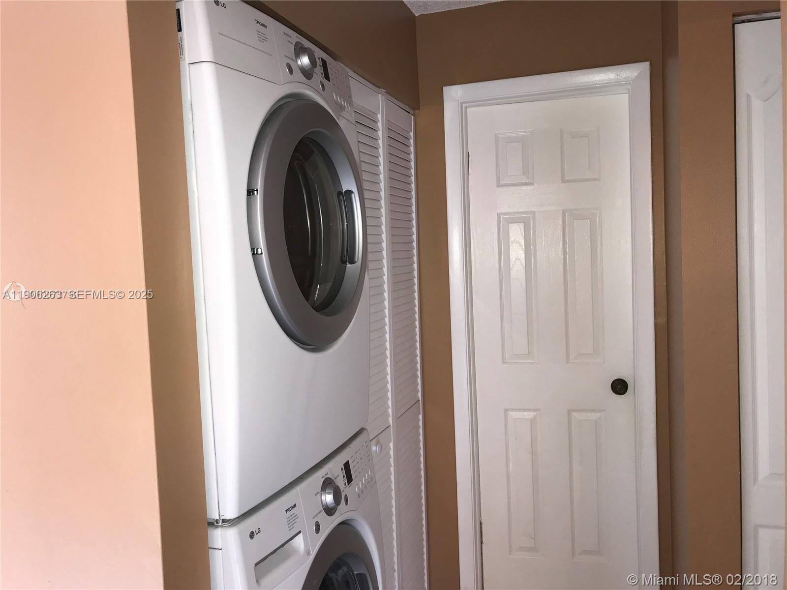 15065 Southwest 49th Lane, Unit E109 Miami, FL 33185 - Photo 8 of 21 a utility room with dryer and washer