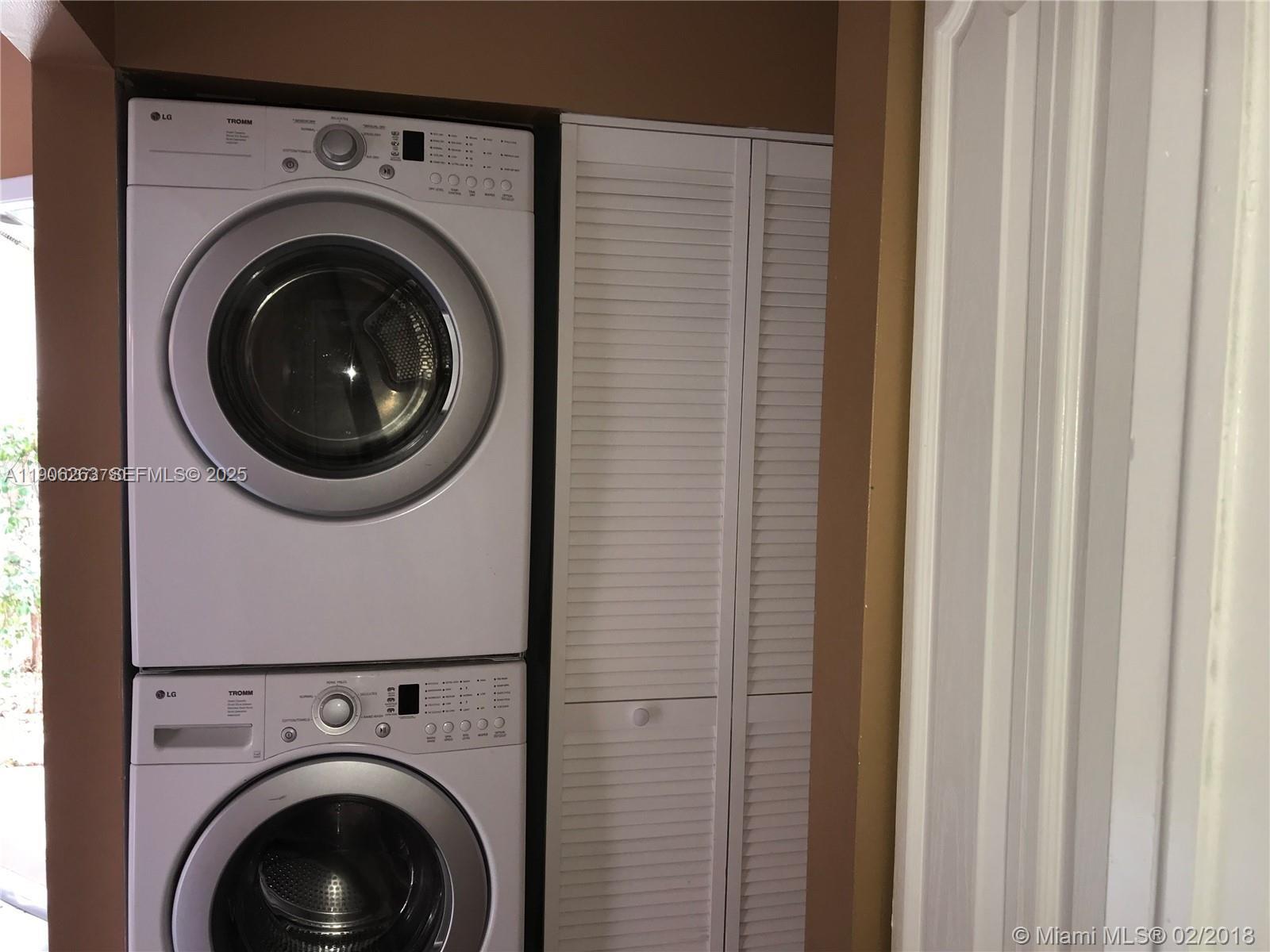 15065 Southwest 49th Lane, Unit E109 Miami, FL 33185 - Photo 9 of 21 a utility room with dryer and washer