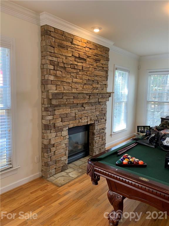 3081 River Bend Drive Tega Cay, SC 29708 - Photo 6 of 15 a room with furniture and a fireplace