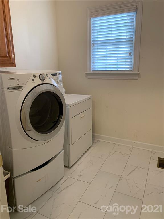 3081 River Bend Drive Tega Cay, SC 29708 - Photo 7 of 15 a utility room with dryer and washer
