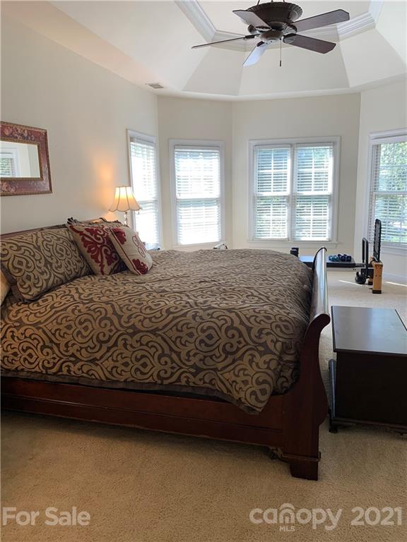 3081 River Bend Drive Tega Cay, SC 29708 - Photo 8 of 15 a bedroom with a bed and window