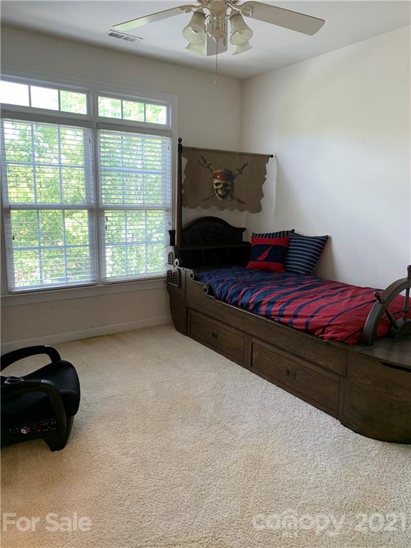 3081 River Bend Drive Tega Cay, SC 29708 - Photo 10 of 15 a bedroom with a bed and a window