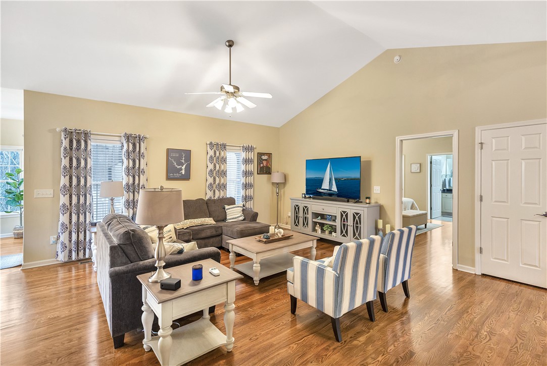 101 Riviera Circle Anderson, SC 29621 - Photo 7 of 35 This inviting space features lustrous wood floors and lofty vaulted ceilings, perfect for relaxed gatherings.