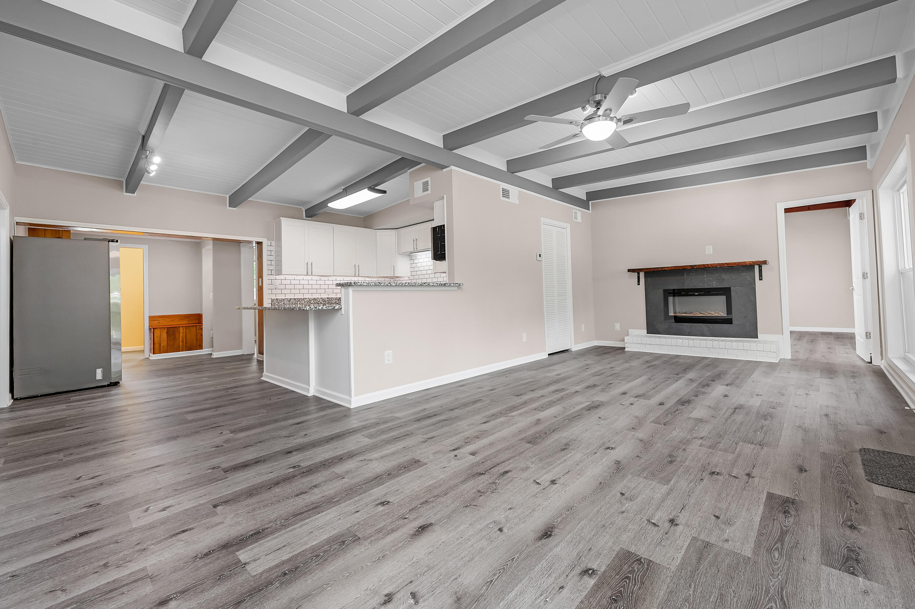 413 Gerold Street Fort Walton Beach, FL 32547 - Photo 15 of 91 a view of empty room with wooden floor fireplace and window