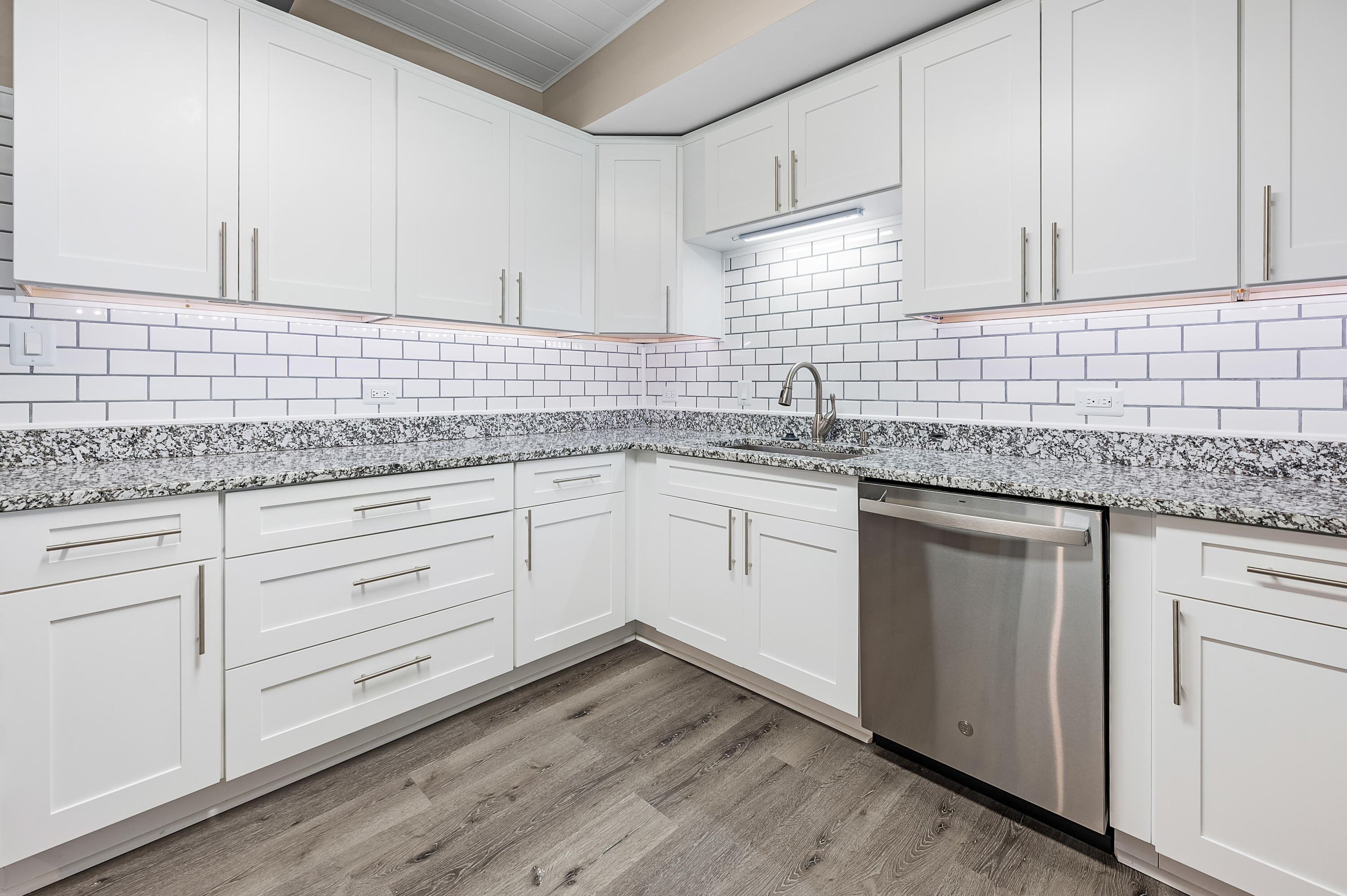 413 Gerold Street Fort Walton Beach, FL 32547 - Photo 20 of 91 a kitchen with granite countertop white cabinets white appliances and sink