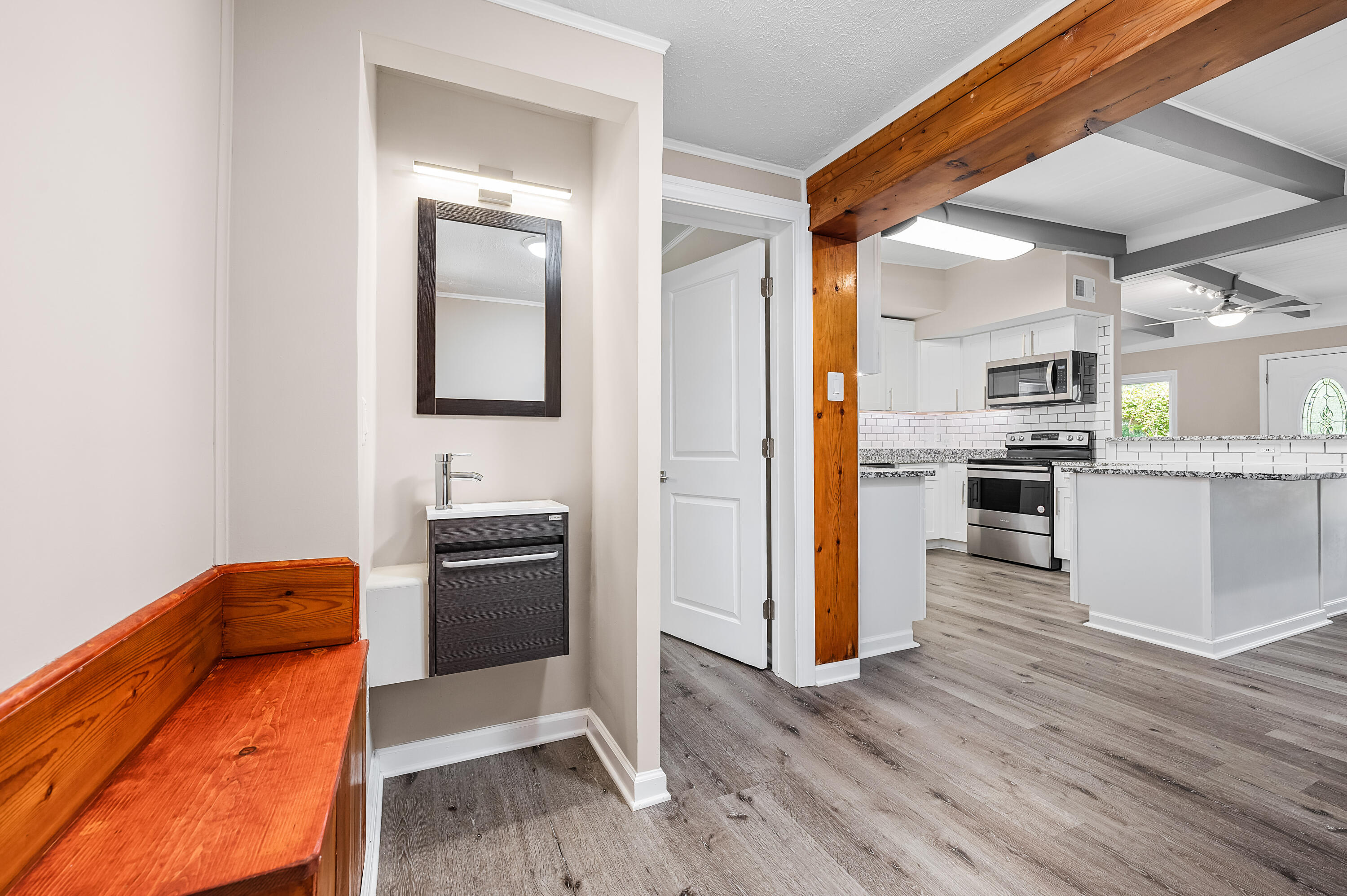 413 Gerold Street Fort Walton Beach, FL 32547 - Photo 28 of 91 a kitchen with stainless steel appliances granite countertop a refrigerator and a stove top oven