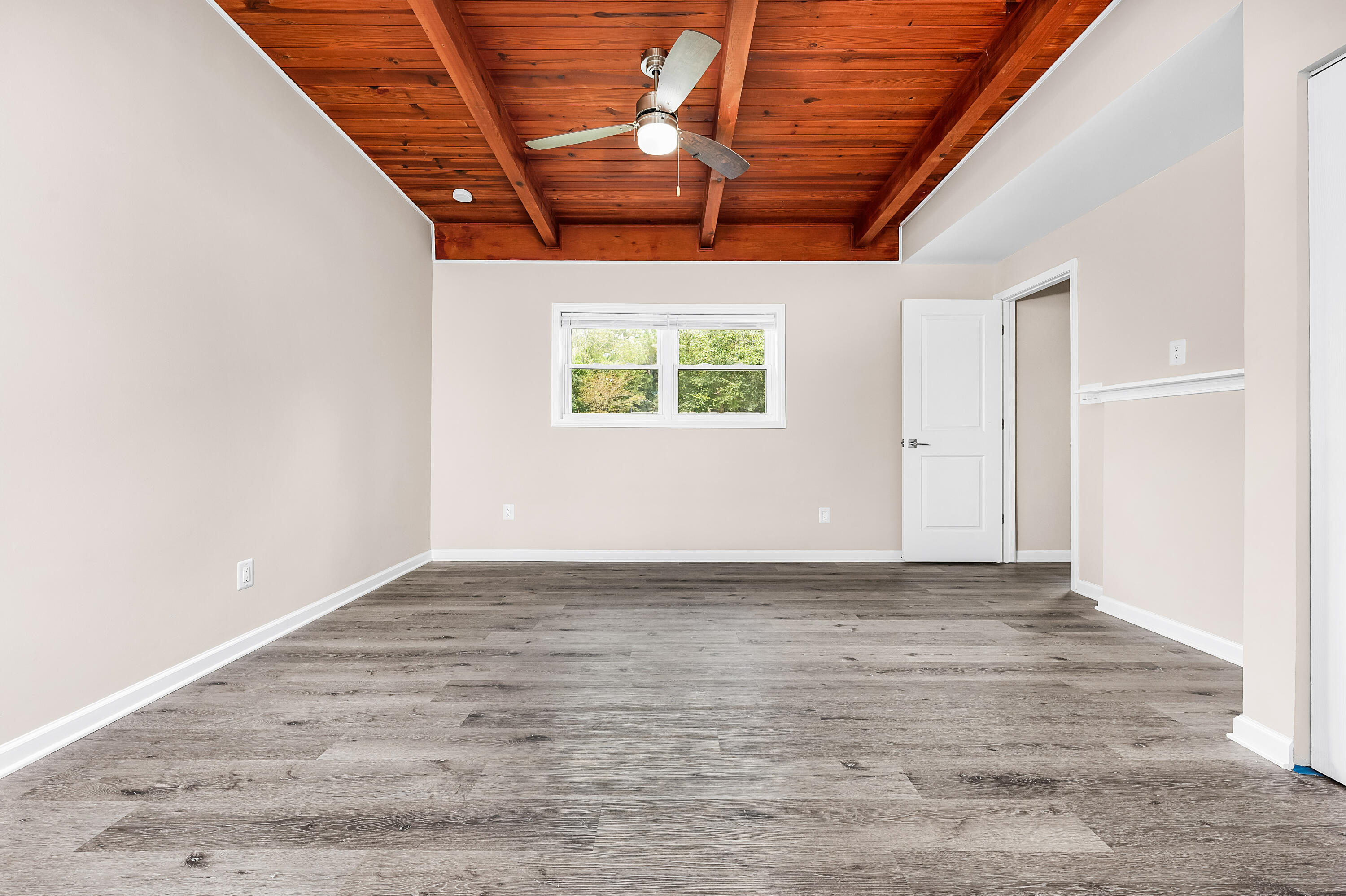 413 Gerold Street Fort Walton Beach, FL 32547 - Photo 31 of 91 an empty room with wooden floor and windows