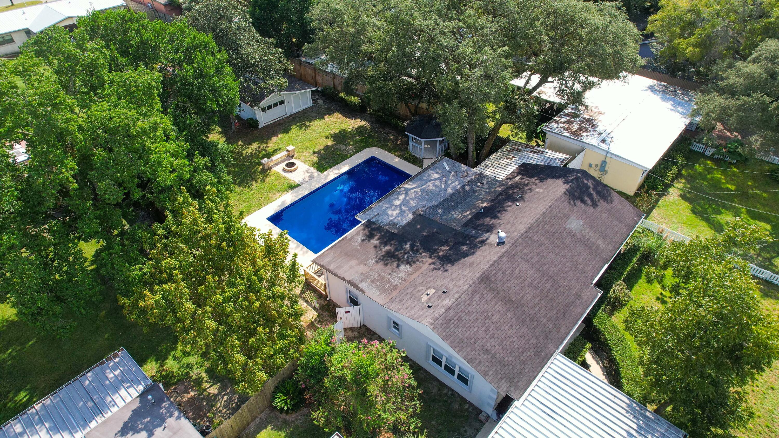 413 Gerold Street Fort Walton Beach, FL 32547 - Photo 4 of 91 an aerial view of a house with a yard wooden table and chairs