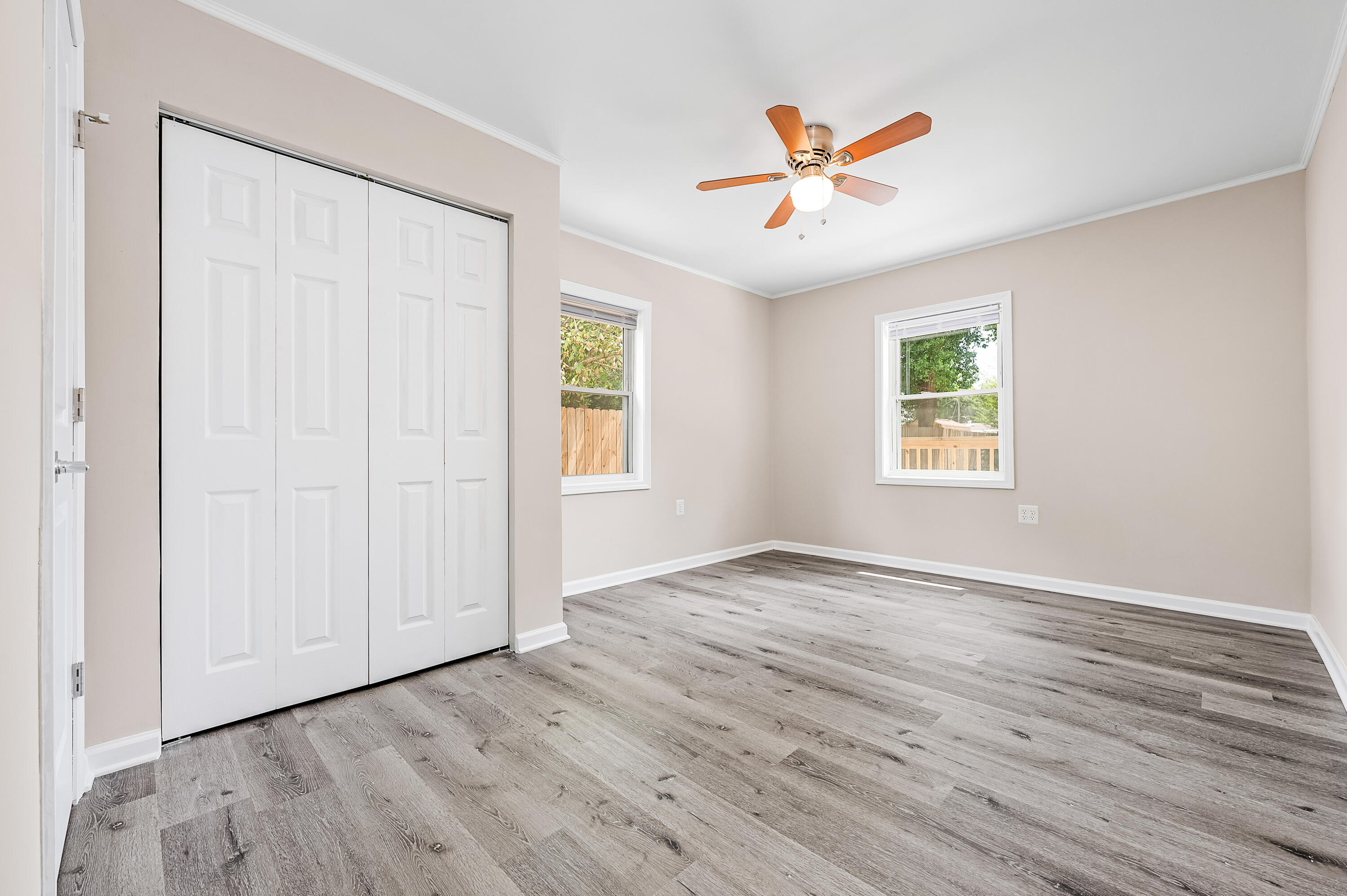 413 Gerold Street Fort Walton Beach, FL 32547 - Photo 44 of 91 an empty room with wooden floor closet and windows