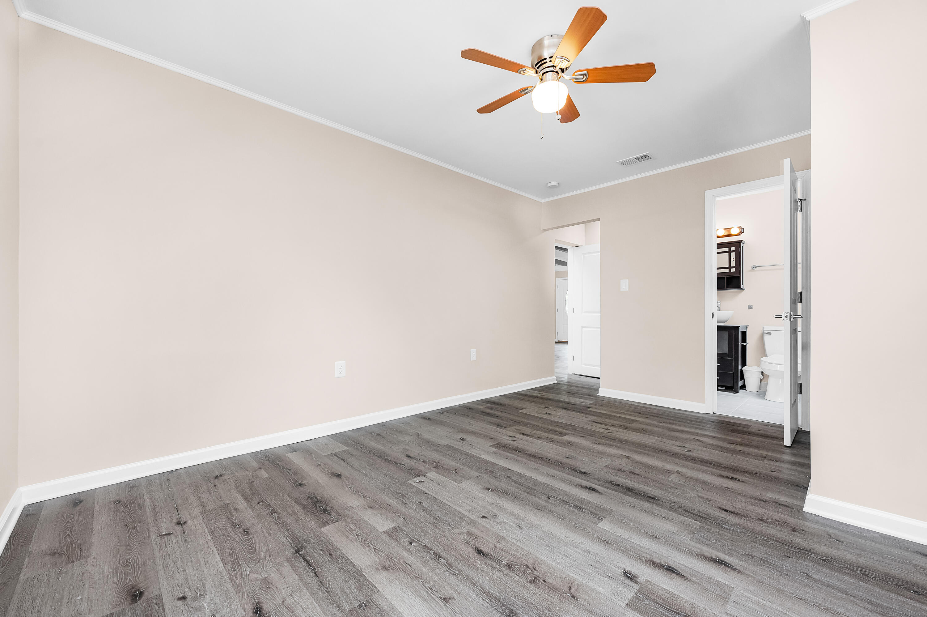 413 Gerold Street Fort Walton Beach, FL 32547 - Photo 45 of 91 a view of a room with wooden floor and a ceiling fan
