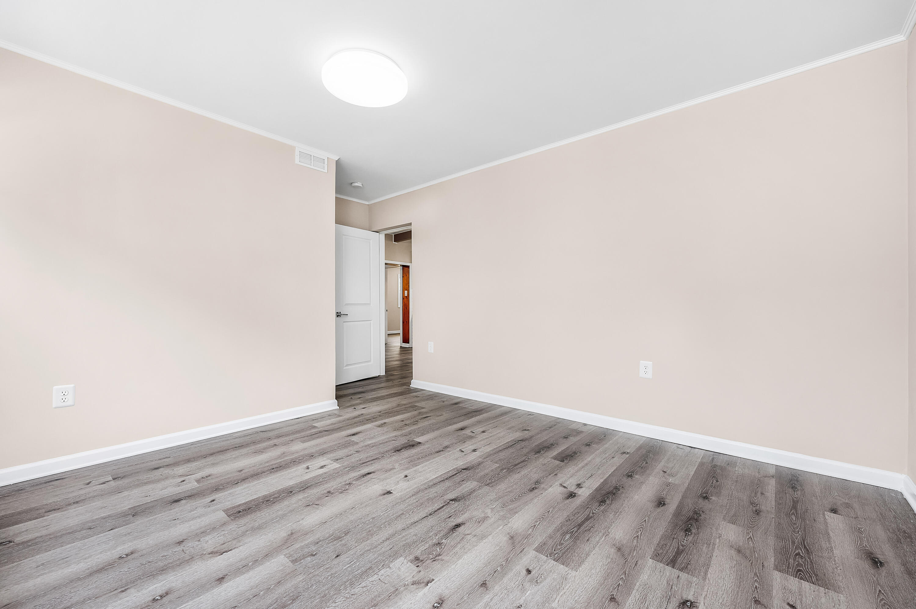 413 Gerold Street Fort Walton Beach, FL 32547 - Photo 51 of 91 an empty room with wooden floor and white walls