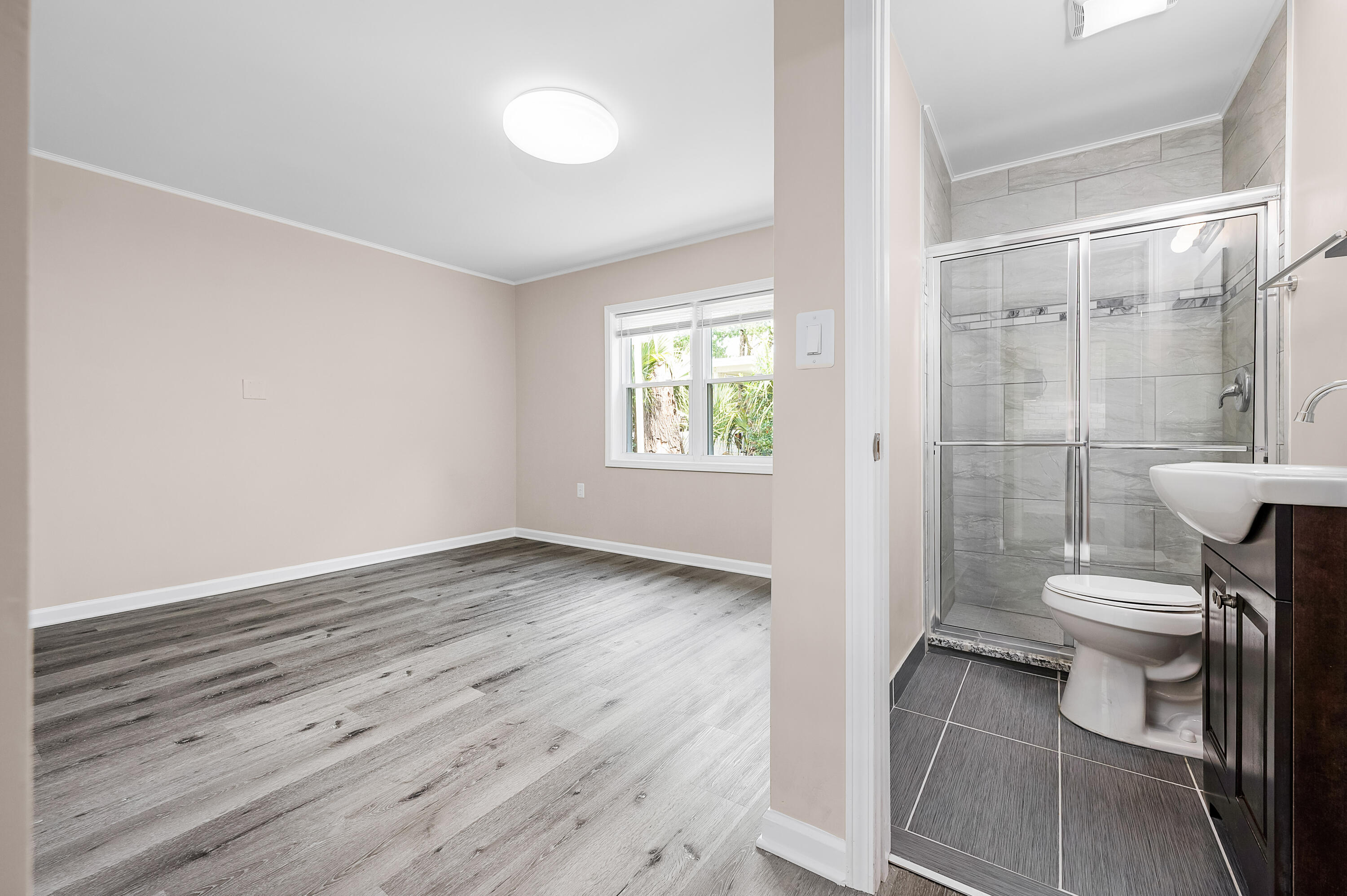 413 Gerold Street Fort Walton Beach, FL 32547 - Photo 53 of 91 a bathroom with a toilet a sink and shower