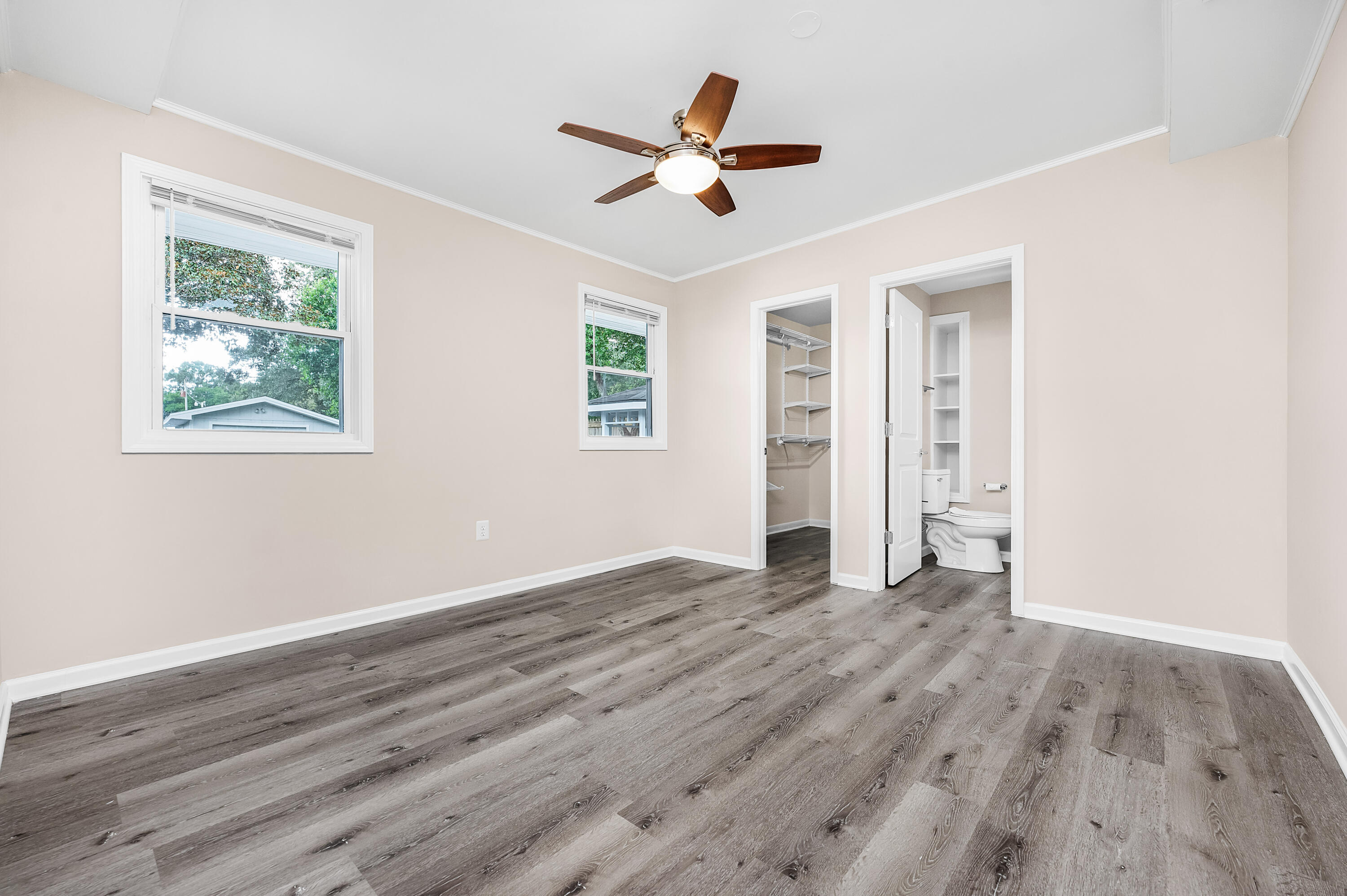 413 Gerold Street Fort Walton Beach, FL 32547 - Photo 56 of 91 a view of an empty room with wooden floor and a window