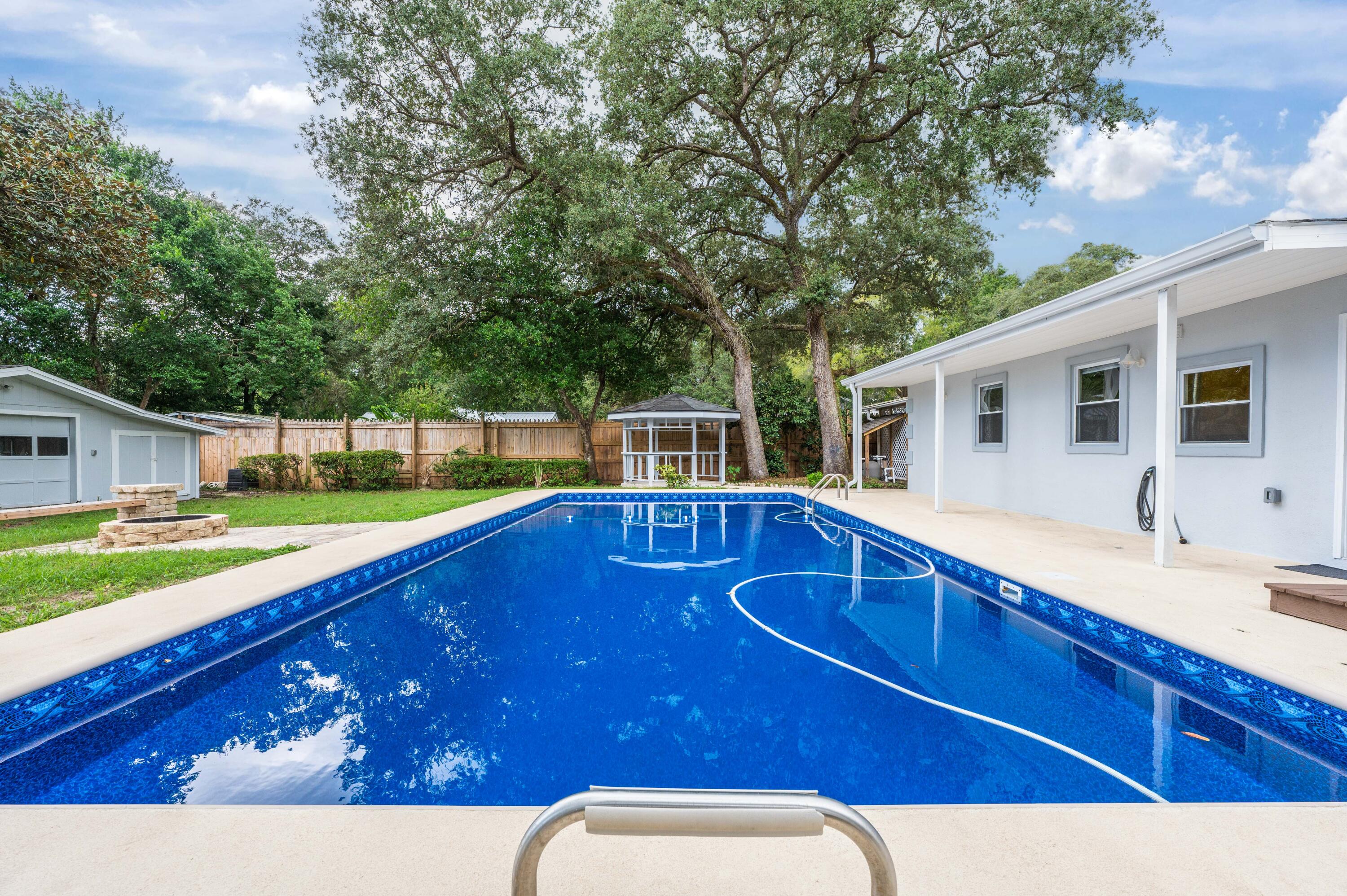 413 Gerold Street Fort Walton Beach, FL 32547 - Photo 65 of 91 a view of a backyard with swimming pool