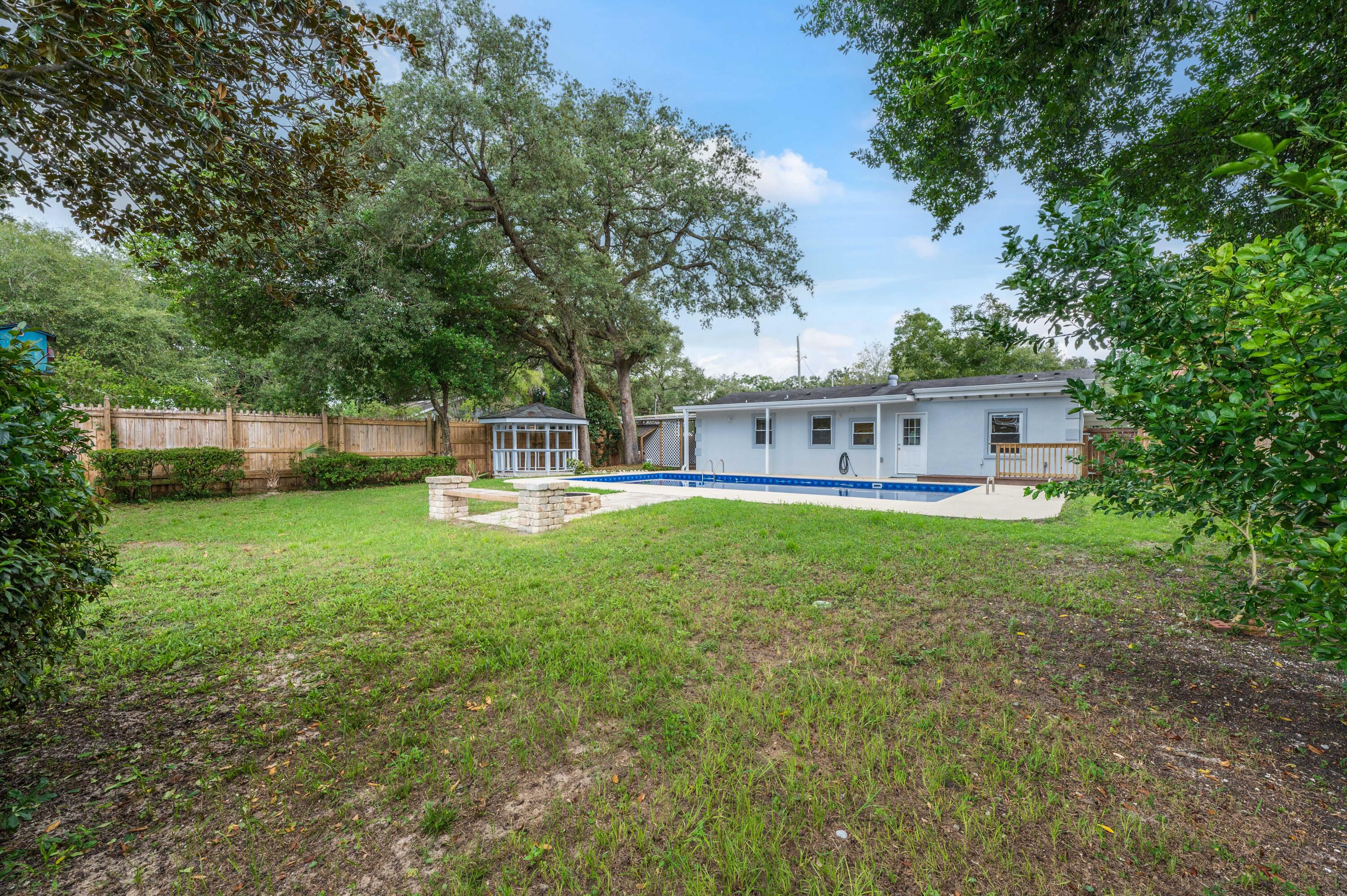 413 Gerold Street Fort Walton Beach, FL 32547 - Photo 77 of 91 a front view of a house with a yard