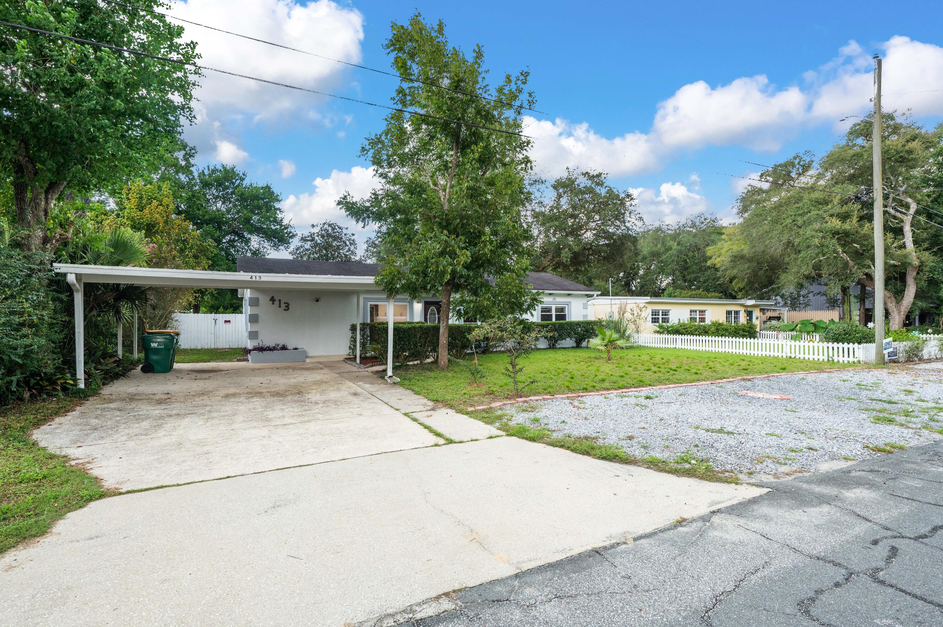 413 Gerold Street Fort Walton Beach, FL 32547 - Photo 79 of 91 a view of a house with a yard and potted plants