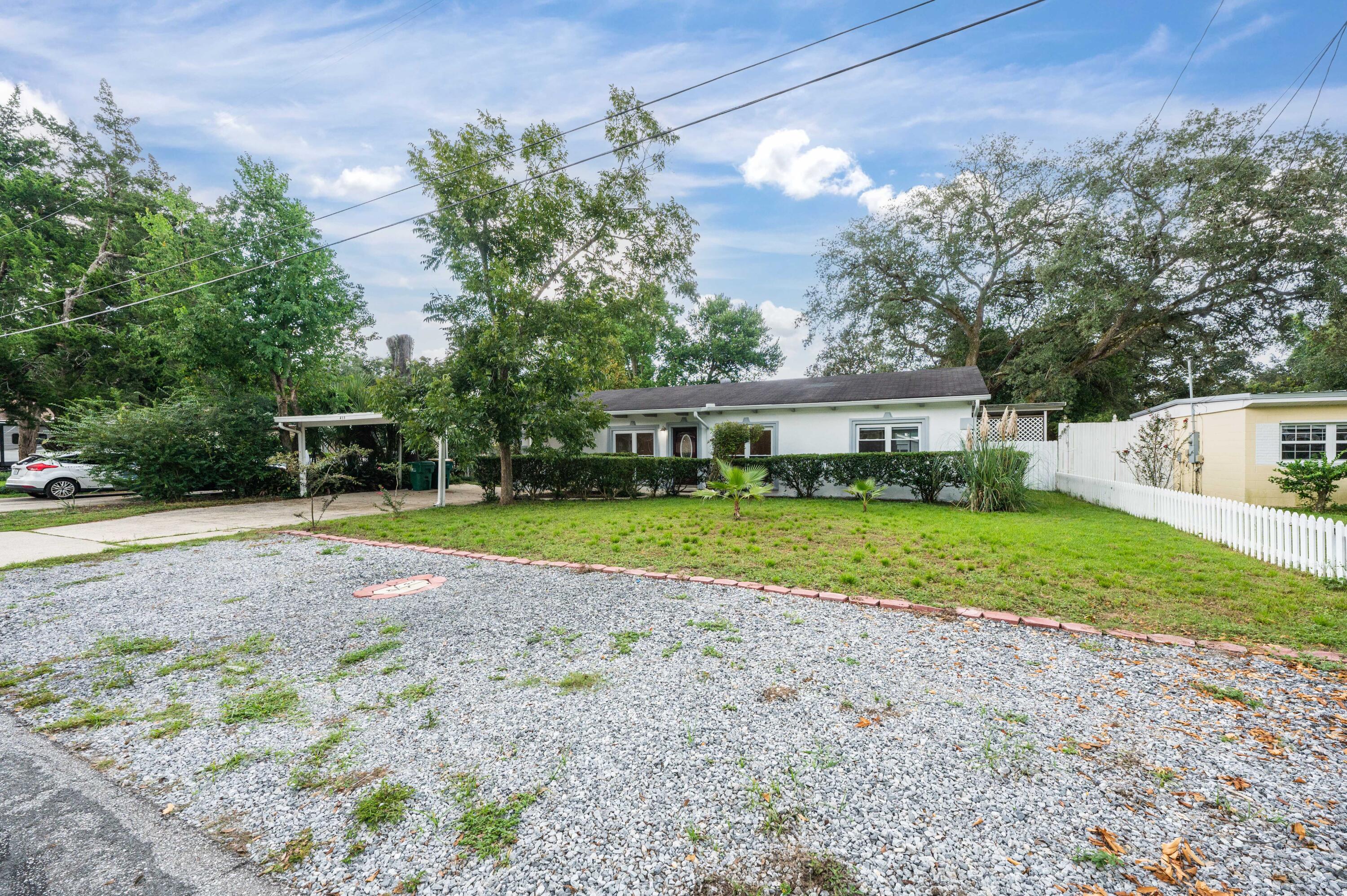 413 Gerold Street Fort Walton Beach, FL 32547 - Photo 81 of 91 a view of a house with backyard and a tree
