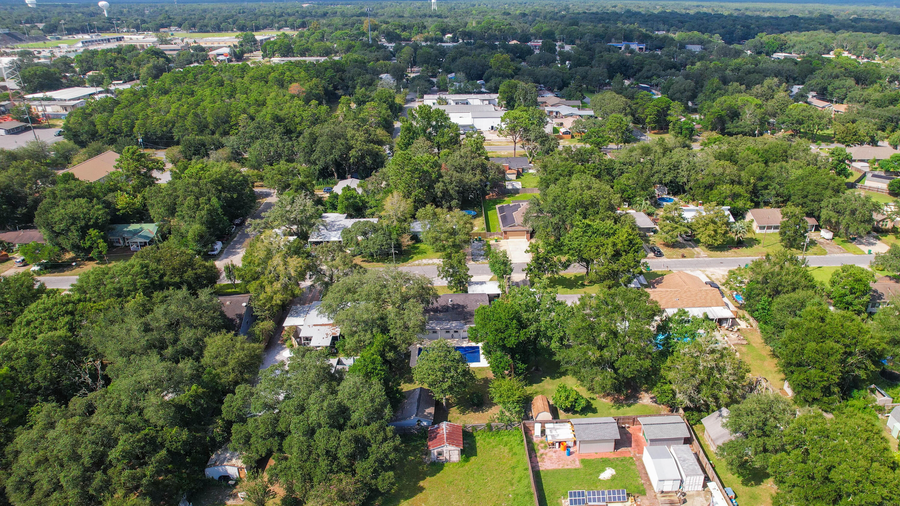 413 Gerold Street Fort Walton Beach, FL 32547 - Photo 82 of 91 an aerial view of residential houses with outdoor space and trees