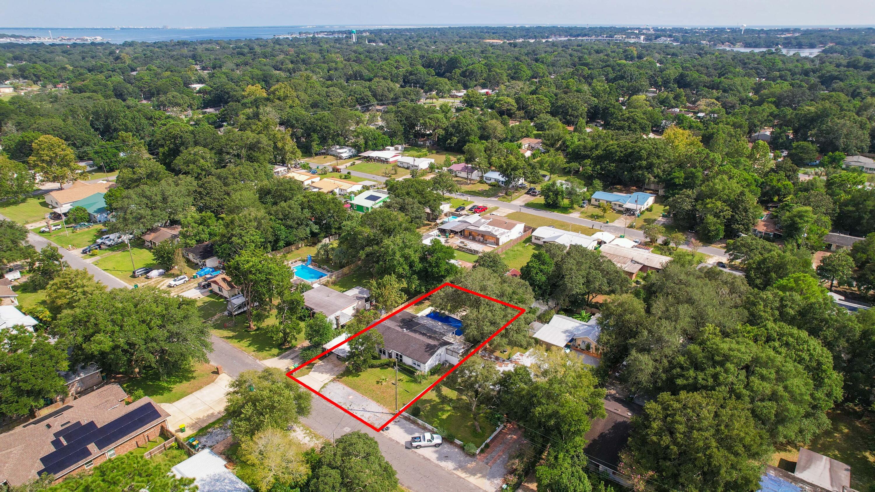 413 Gerold Street Fort Walton Beach, FL 32547 - Photo 84 of 91 an aerial view of residential houses with outdoor space and trees