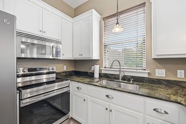 a bathroom with a shower and a sink