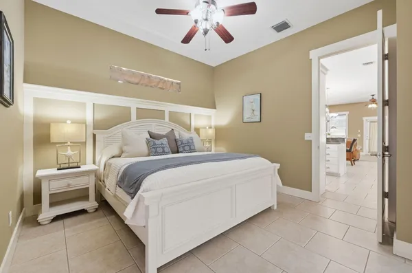 a spacious bedroom with a bed and a couch