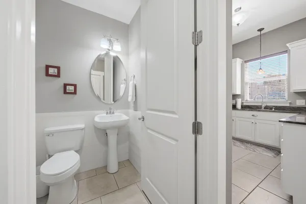 a bathroom with a mirror and a sink