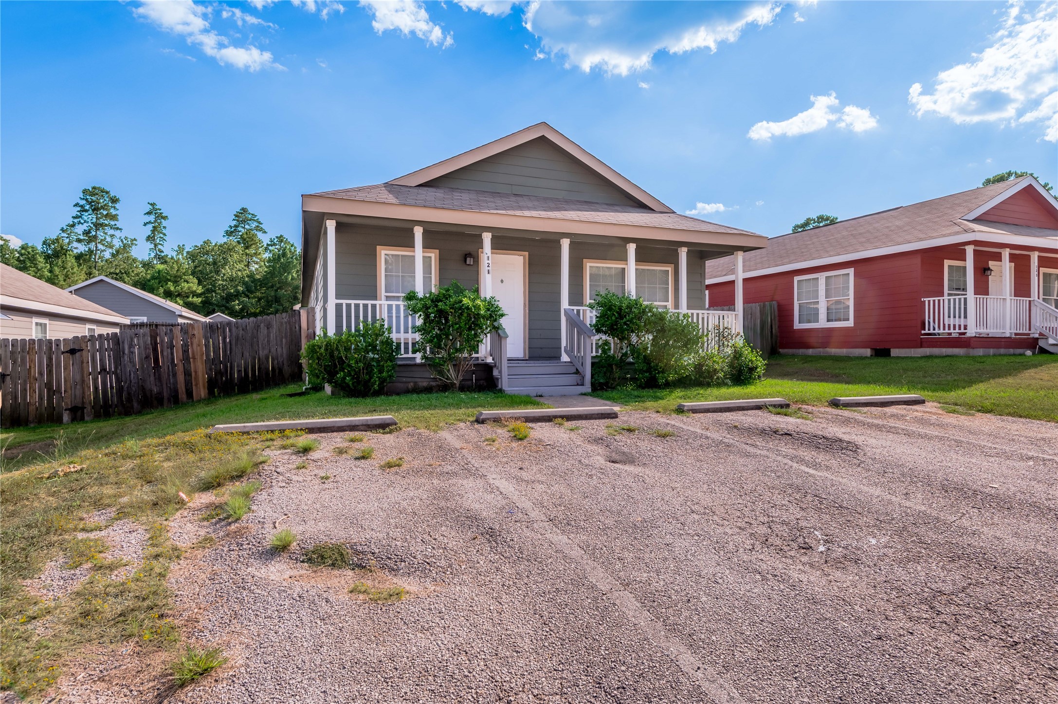 121 Varsity Circle Huntsville, TX 77340 - Photo 2 of 32 a front view of a house with a yard and outdoor seating