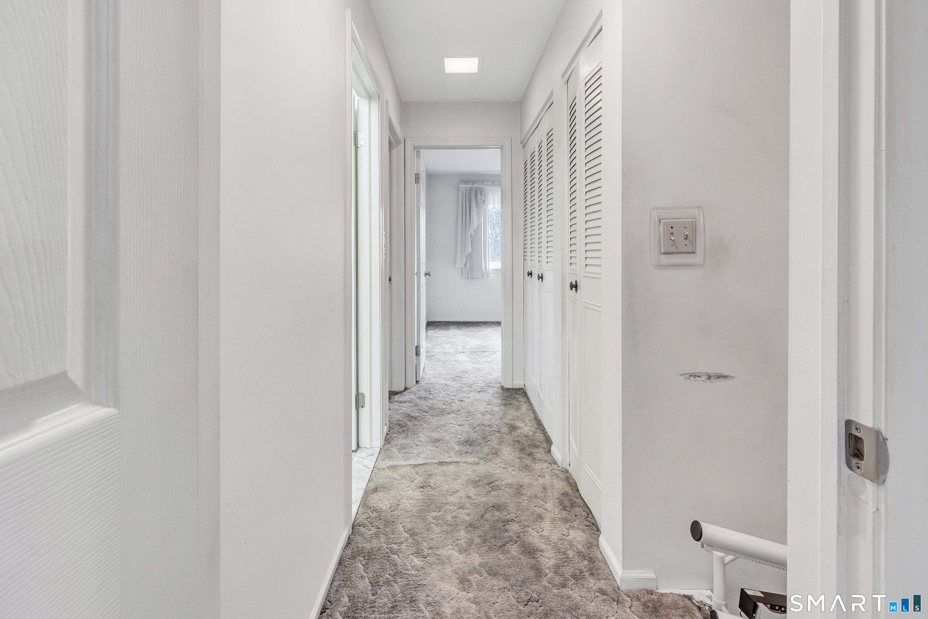 330 Merwin Avenue, Unit 1D Milford, CT 06460 - Photo 13 of 39 a view of a hallway with a white walls