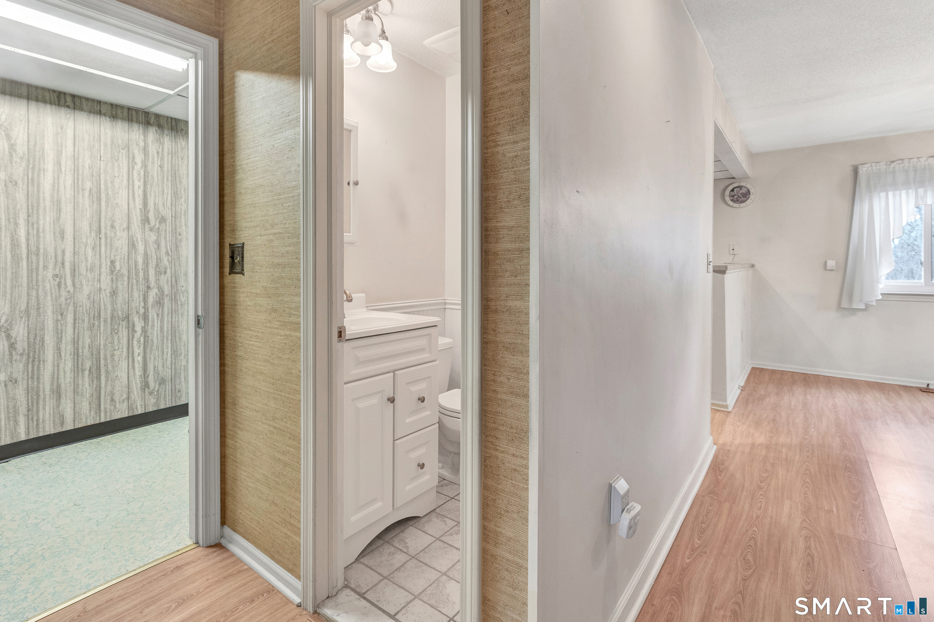 330 Merwin Avenue, Unit 1D Milford, CT 06460 - Photo 14 of 39 a view of a hallway with wooden floor and staircase