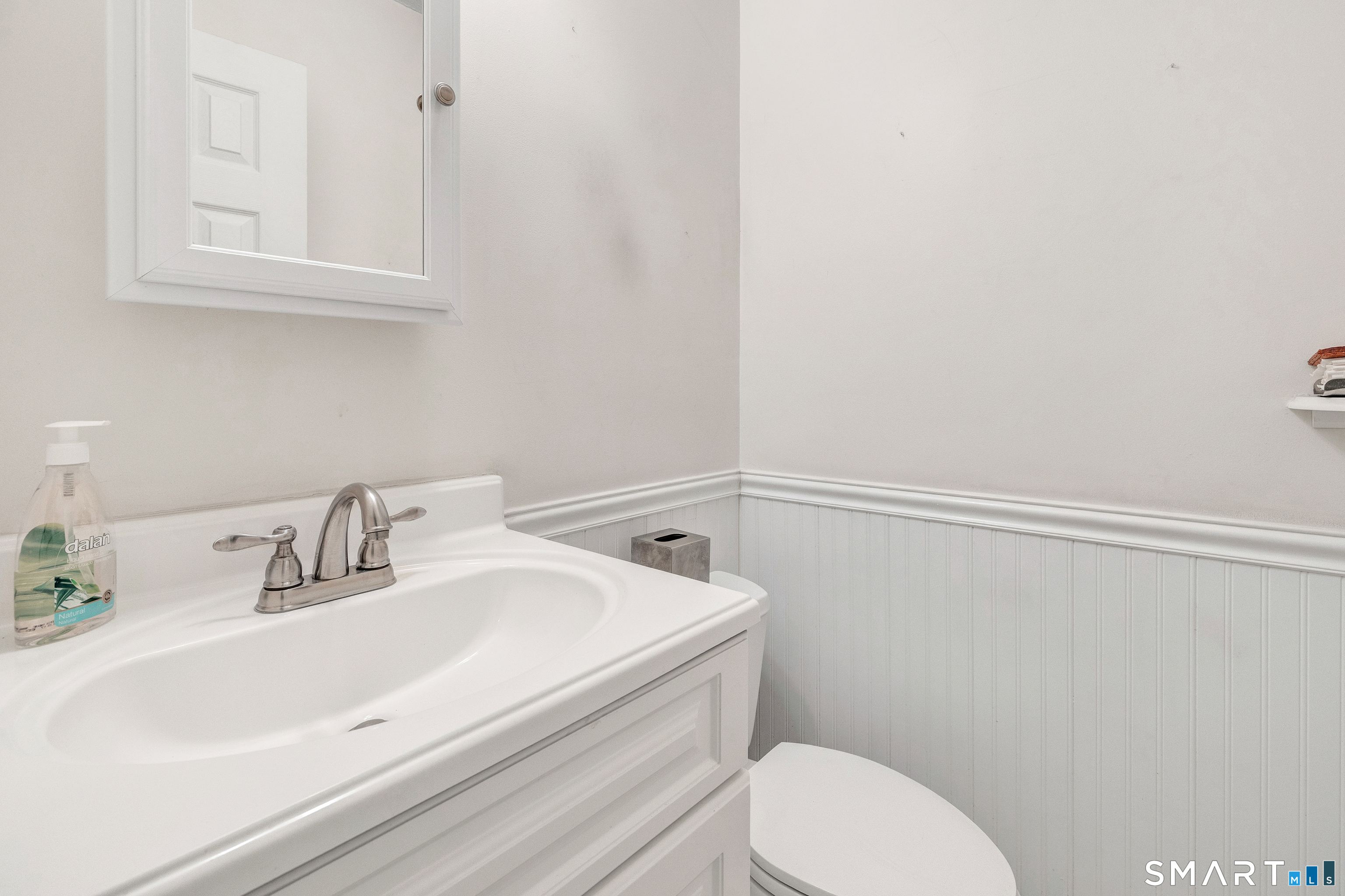 330 Merwin Avenue, Unit 1D Milford, CT 06460 - Photo 17 of 39 a bathroom with a sink a toilet and vanity