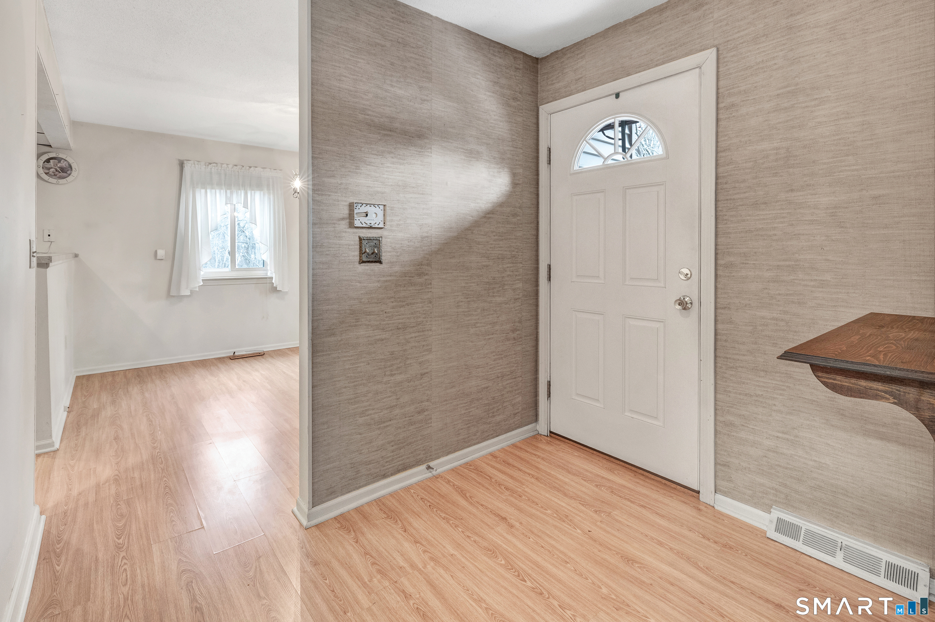 330 Merwin Avenue, Unit 1D Milford, CT 06460 - Photo 6 of 39 an empty room with wooden floor and windows