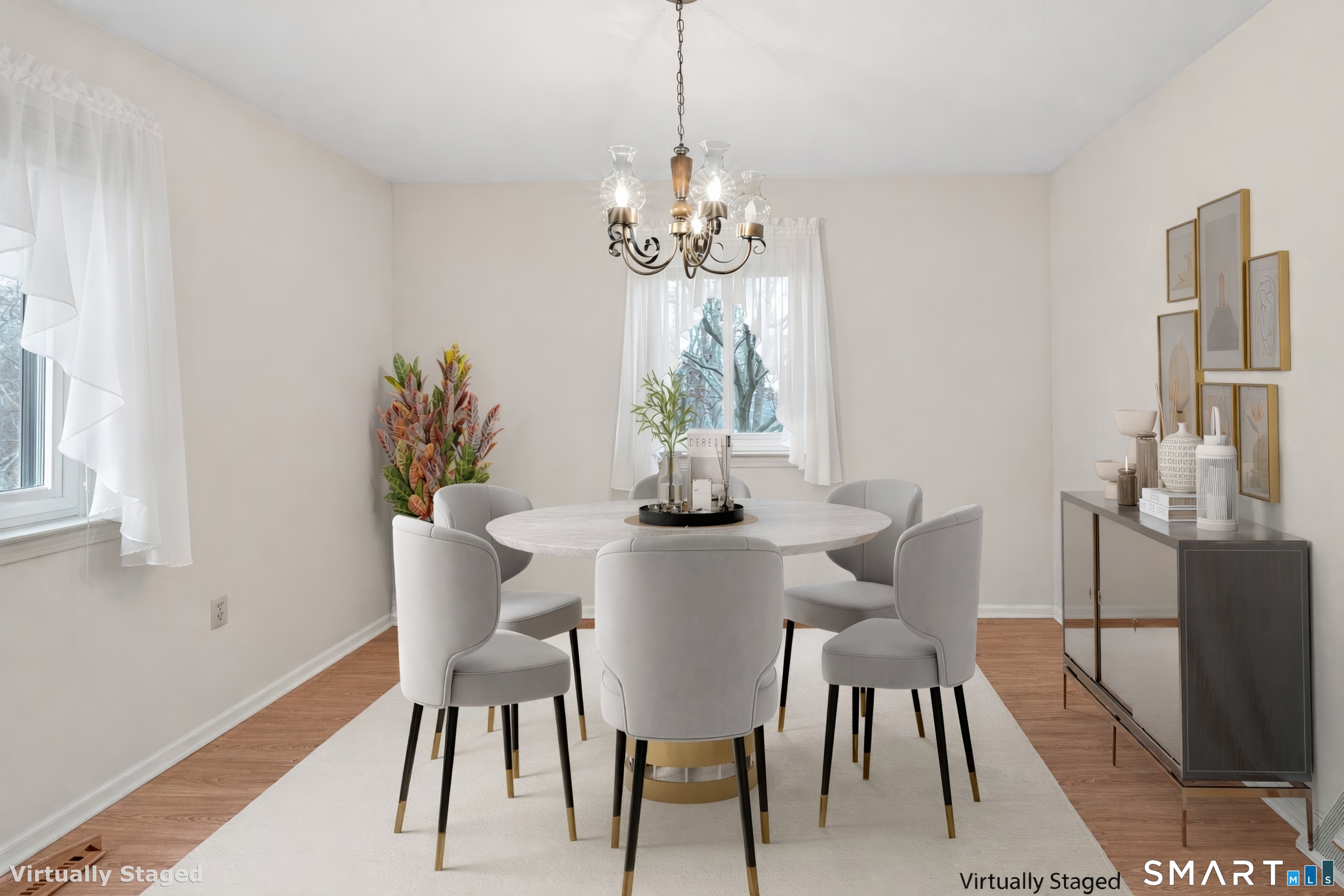 330 Merwin Avenue, Unit 1D Milford, CT 06460 - Photo 9 of 39 a dining room with furniture potted plants and wooden floor