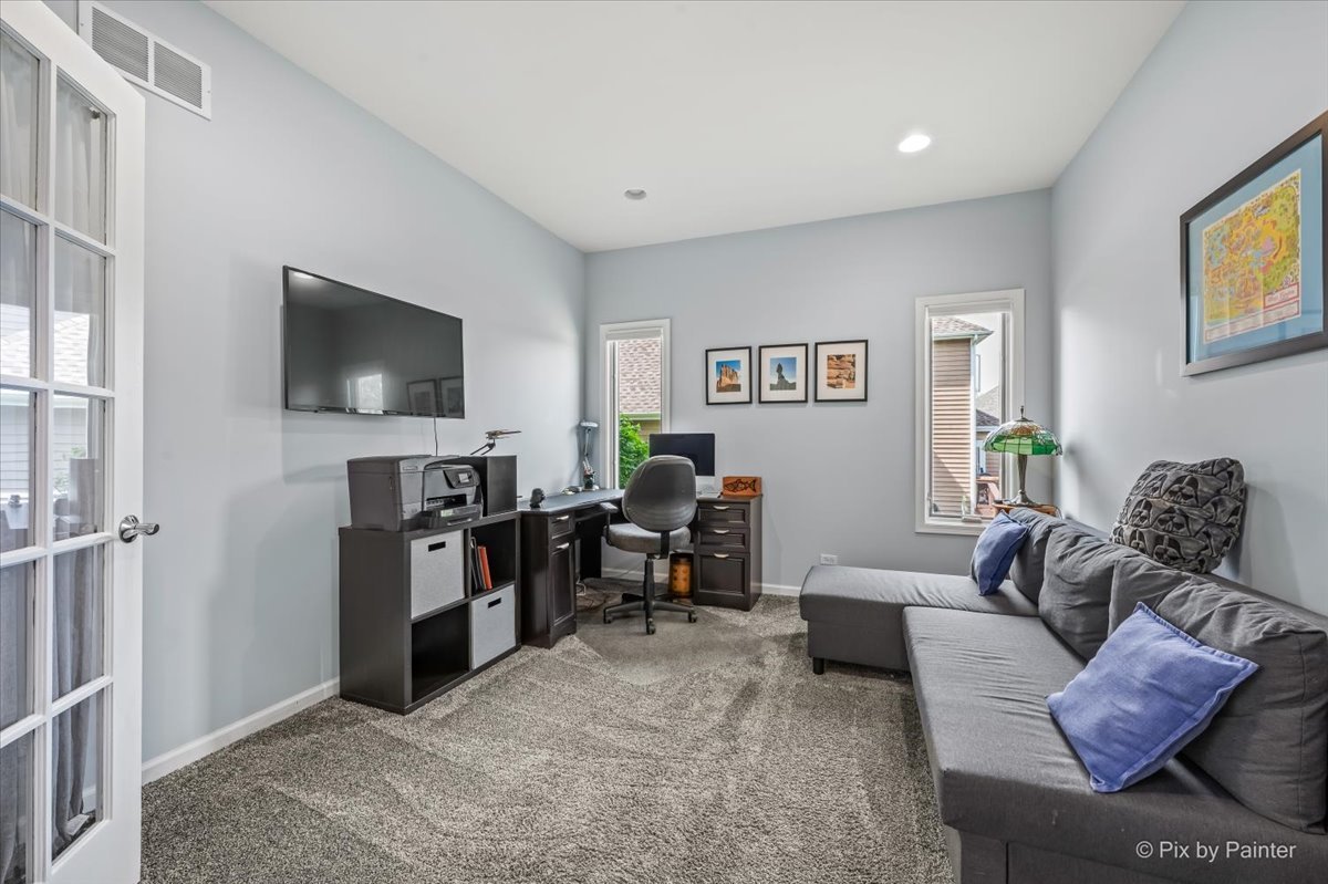 7104 Dove Way Cary, IL 60013 - Photo 12 of 82 a living room with furniture and a flat screen tv