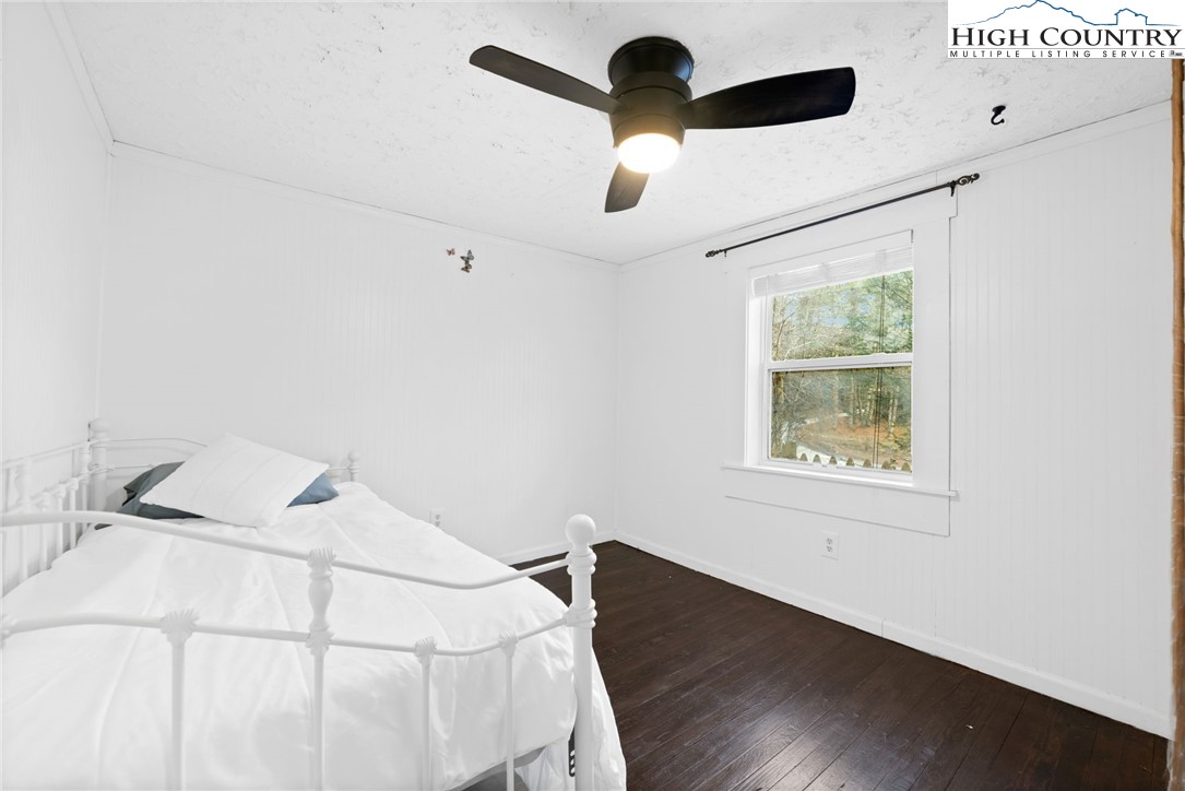 295 Jake's Mountain Road Boone, NC 28607 - Photo 18 of 47 a bedroom with a bed and a window