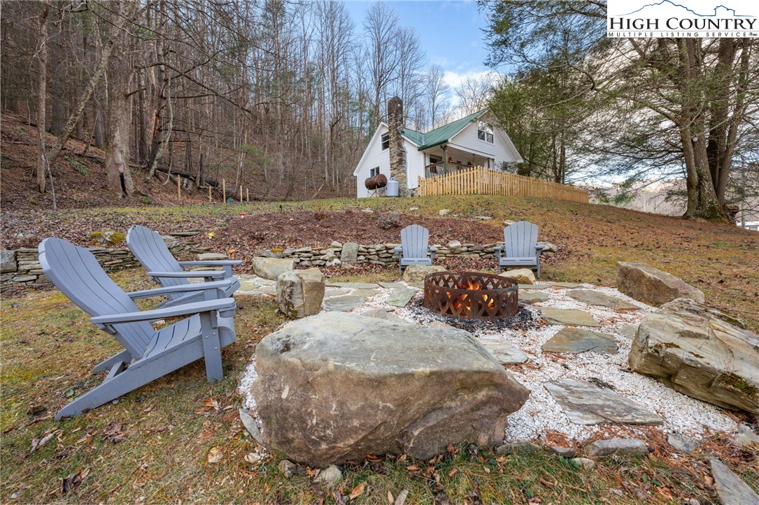 295 Jake's Mountain Road Boone, NC 28607 - Photo 30 of 47 a view of a backyard with sitting area