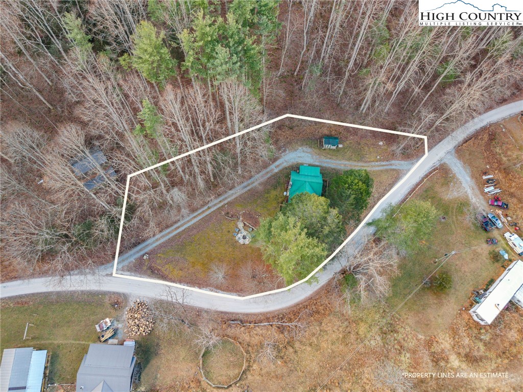 295 Jake's Mountain Road Boone, NC 28607 - Photo 3 of 47 a view of a small pool with a yard in front of it