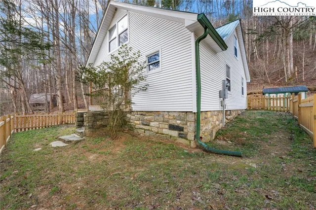 a view of balcony with wooden floor and fence