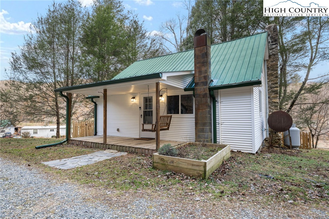295 Jake's Mountain Road Boone, NC 28607 - Photo 40 of 47 a front view of a house with garden