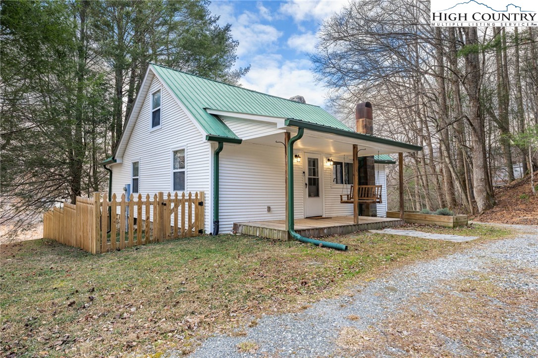 295 Jake's Mountain Road Boone, NC 28607 - Photo 5 of 47 a view of a house with backyard and trees