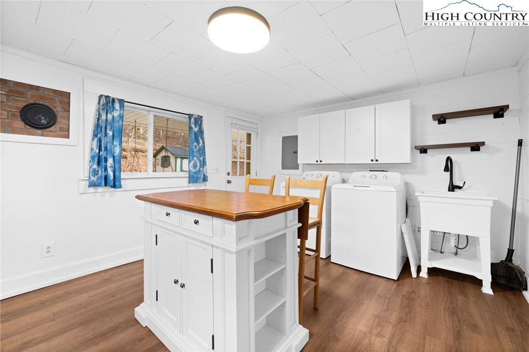 295 Jake's Mountain Road Boone, NC 28607 - Photo 8 of 47 a kitchen with a sink a stove and cabinets