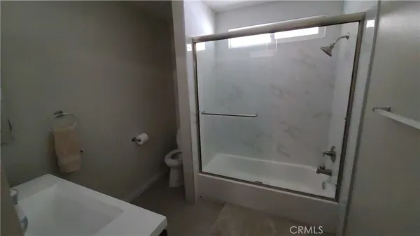 a kitchen with stainless steel appliances a sink stove and cabinets