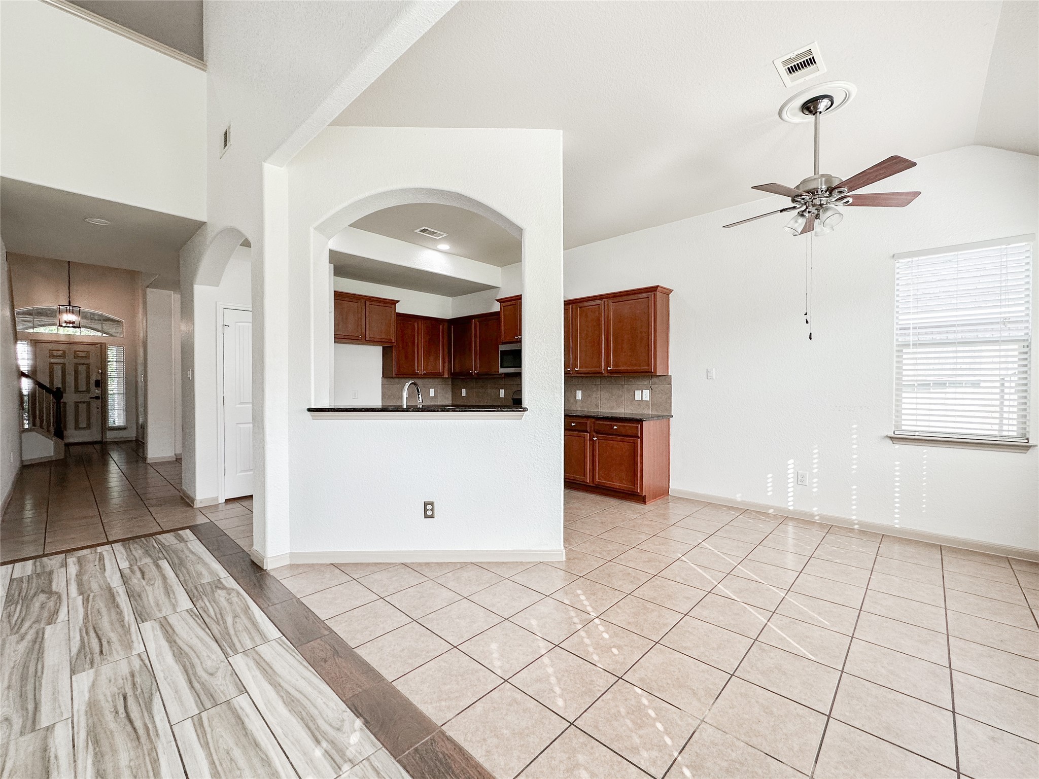 20319 Little Wing Drive Spring, TX 77388 - Photo 23 of 49 a view of a kitchen with wooden floor and a refrigerator