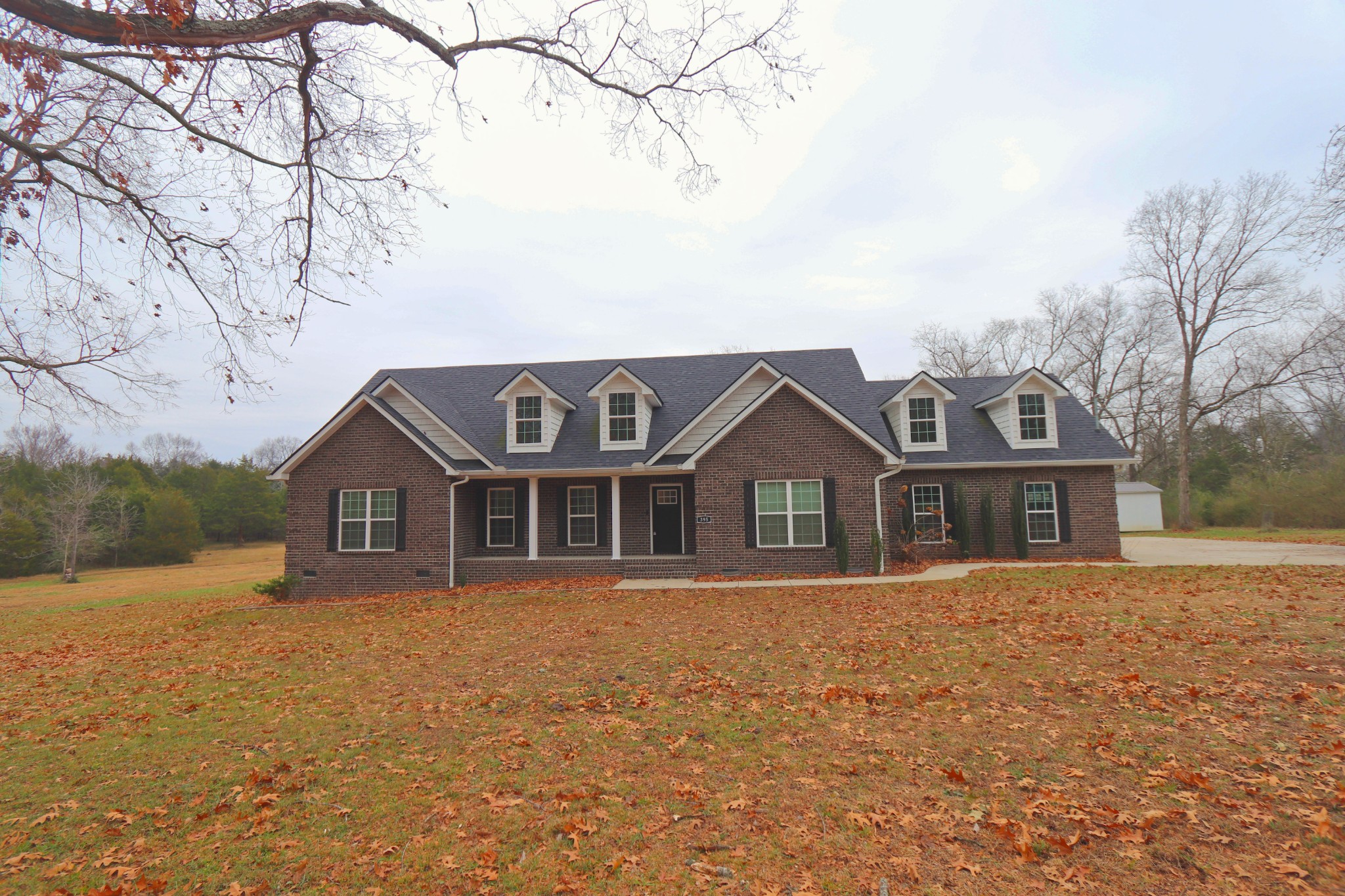 395 Harrison Road Shelbyville, TN 37160 - Photo 1 of 30 front view of a house with a yard