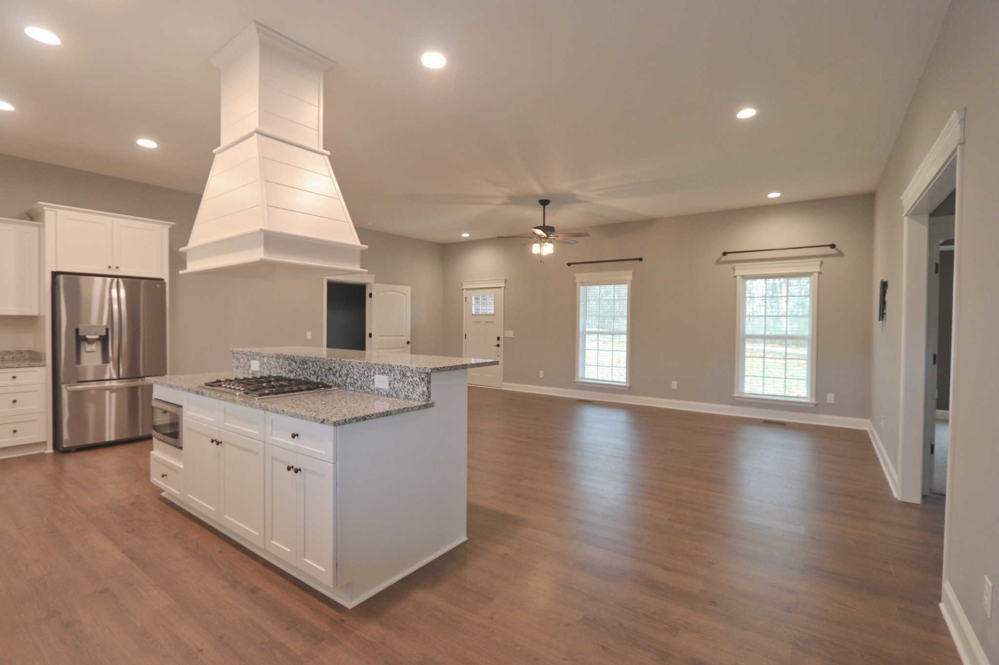395 Harrison Road Shelbyville, TN 37160 - Photo 14 of 30 a kitchen with stainless steel appliances granite countertop a stove and a large refrigerator
