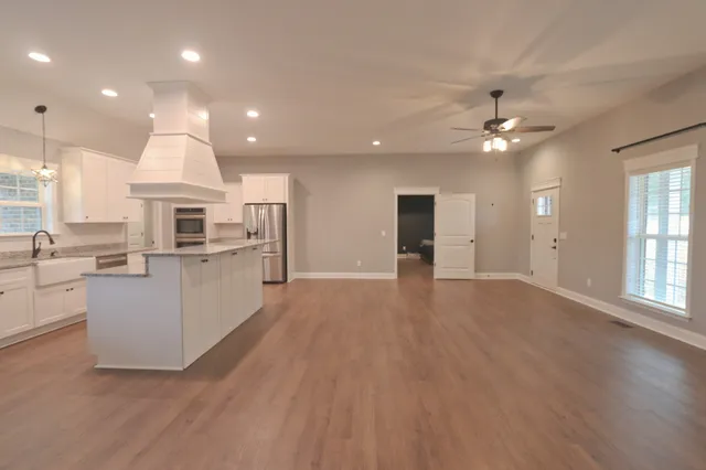 a view of kitchen with cabinets and wooden floor