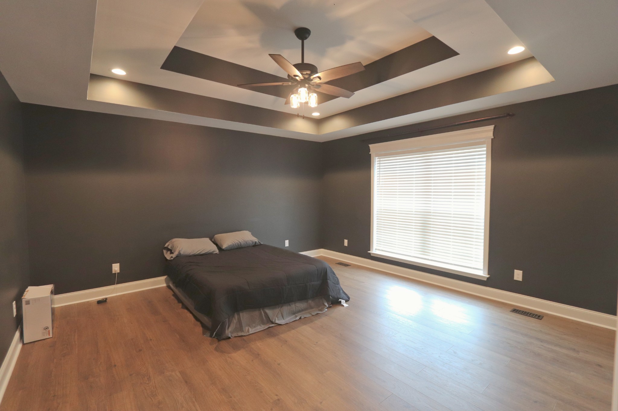 395 Harrison Road Shelbyville, TN 37160 - Photo 21 of 30 an empty room with a chandelier fan and windows