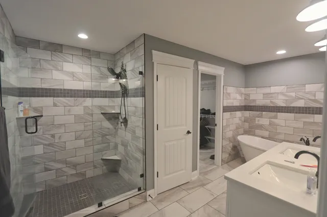 a bathroom with a shower and a sink