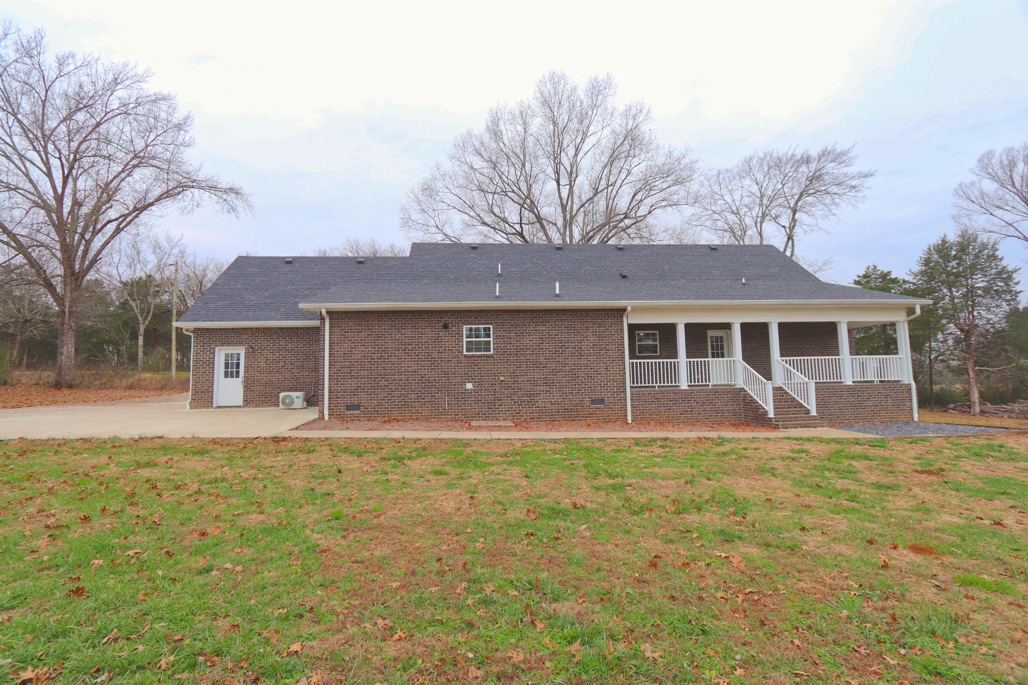 395 Harrison Road Shelbyville, TN 37160 - Photo 30 of 30 a front view of a house with a yard