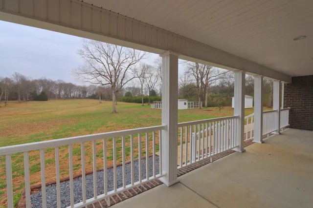 a view of balcony with outdoor space and mountain view